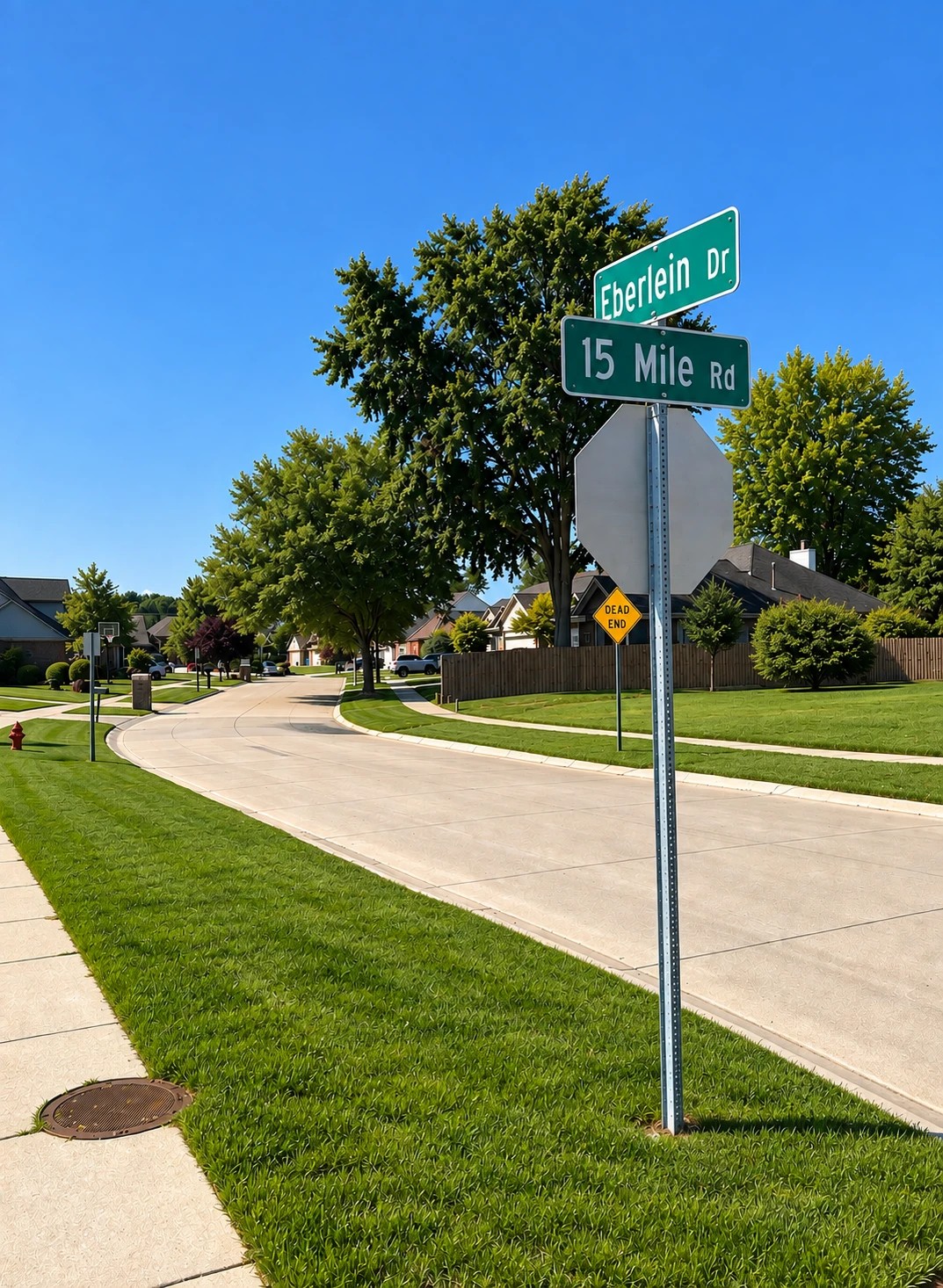 The Eberlein Drive street sign at 15 Mile Road in Fraser, Michigan, with a dead end sign below it.