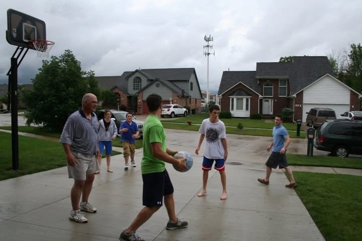 Friends playing basketball in a driveway on Eberlein Drive.